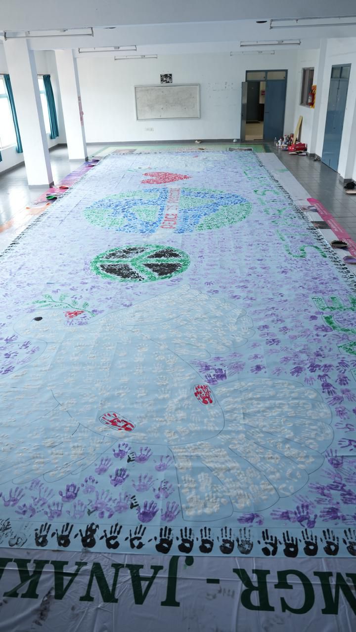 Touch of Peace” with 100  participants, who contributed their hand prints to create a 45 feet × 15 feet banner to promote peace and unity.