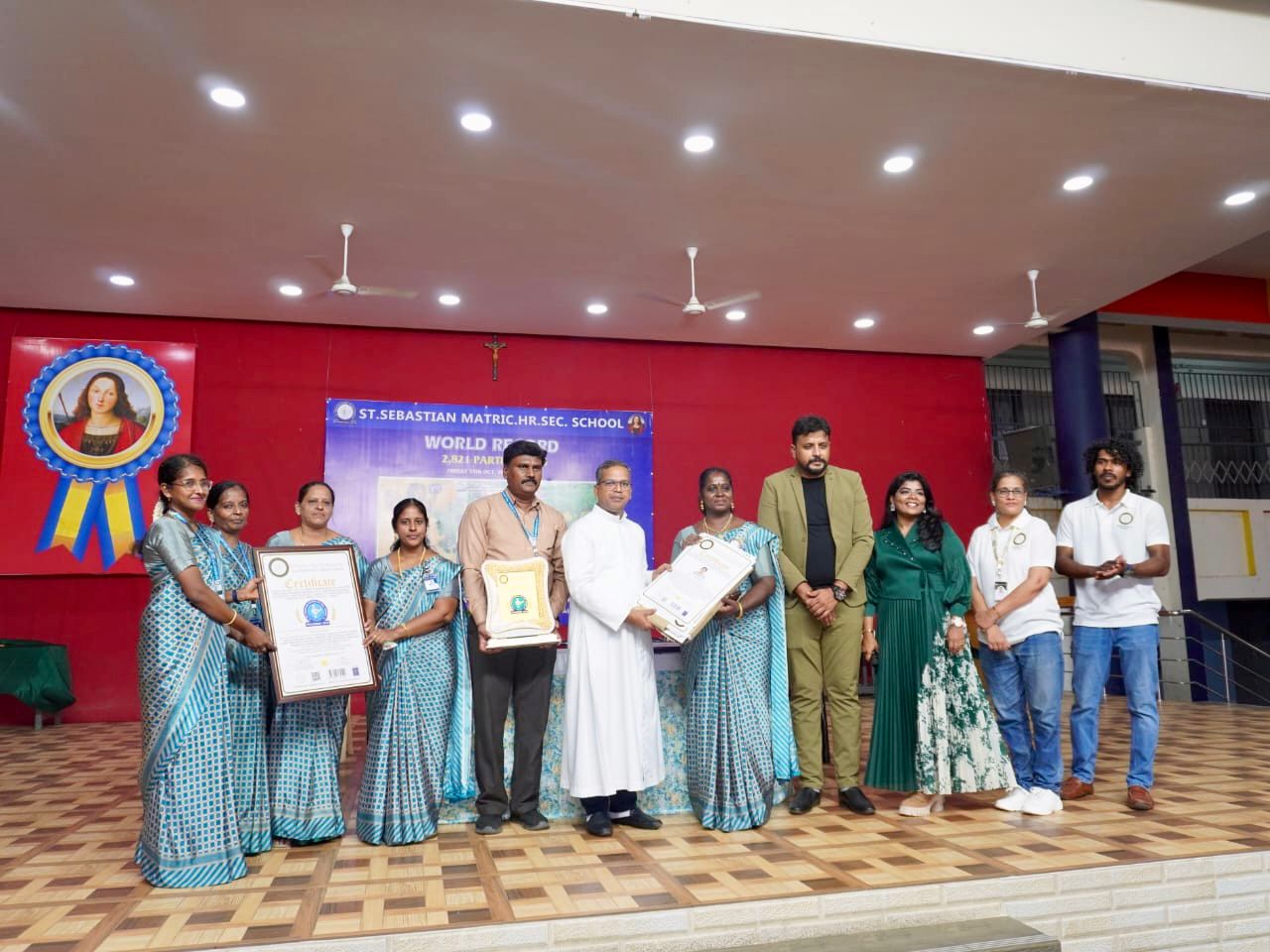 The Largest Human Motion Formation Depicting a Woman Walking with a Lantern and a Book, Achieved by 2,821 Individuals, under the Theme ‘Marching Towards Well-being through Literacy.