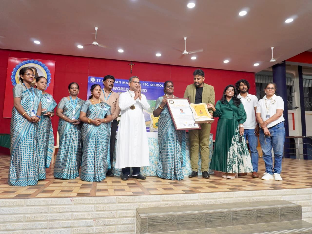The Largest Human Motion Formation Depicting a Woman Walking with a Lantern and a Book, Achieved by 2,821 Individuals, under the Theme ‘Marching Towards Well-being through Literacy.