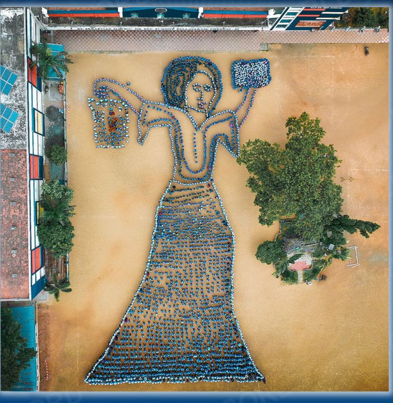 The Largest Human Motion Formation Depicting a Woman Walking with a Lantern and a Book, Achieved by 2,821 Individuals, under the Theme ‘Marching Towards Well-being through Literacy.